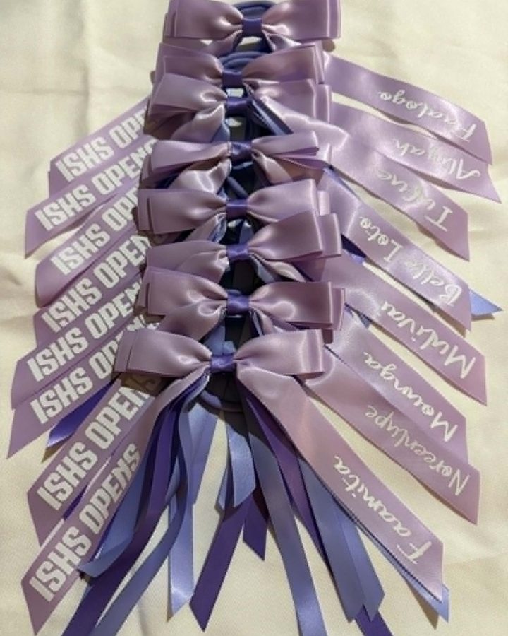 Lilac and purple ISHS ribbons with names